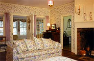 The honeymoon suite at Bailey's B&B includes a big fireplace and king size bed, sofa and closed in balcony