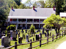 A summer view of Bailey's Bed and Breakfast showing the cemetery in the foreground