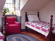 The Rood Room is named for the last miller to run the mill, George Rood. It has a set of bunk beds , a single pineapple bed with a Vermont made bearpaw quilt, a single bed loft and a double bed loft. This is a small room with nooks and crannies that close families and children love!